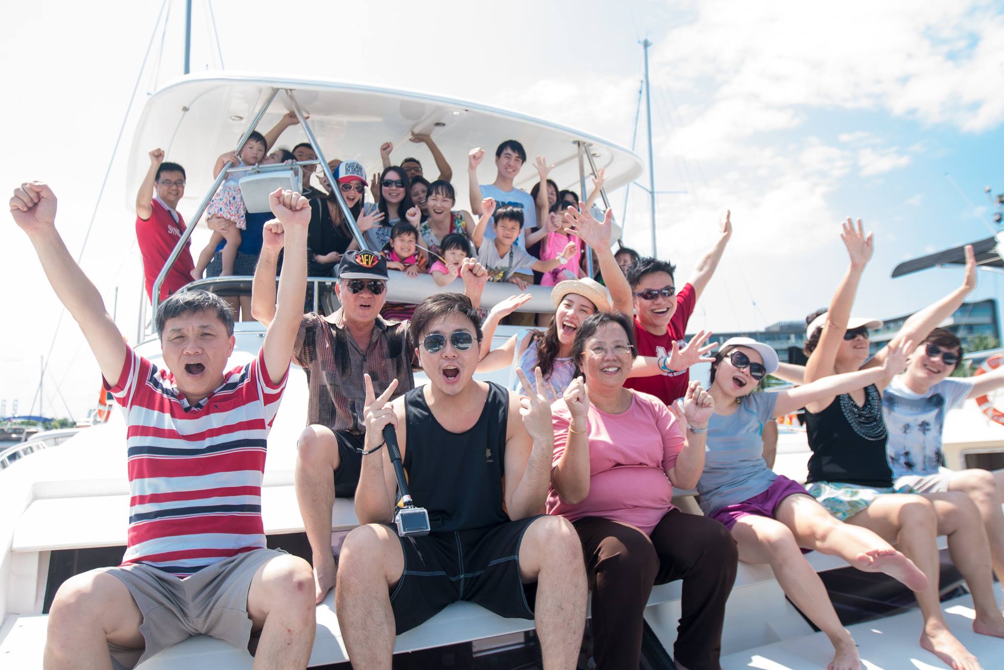 Group of people having fun onboard a yacht