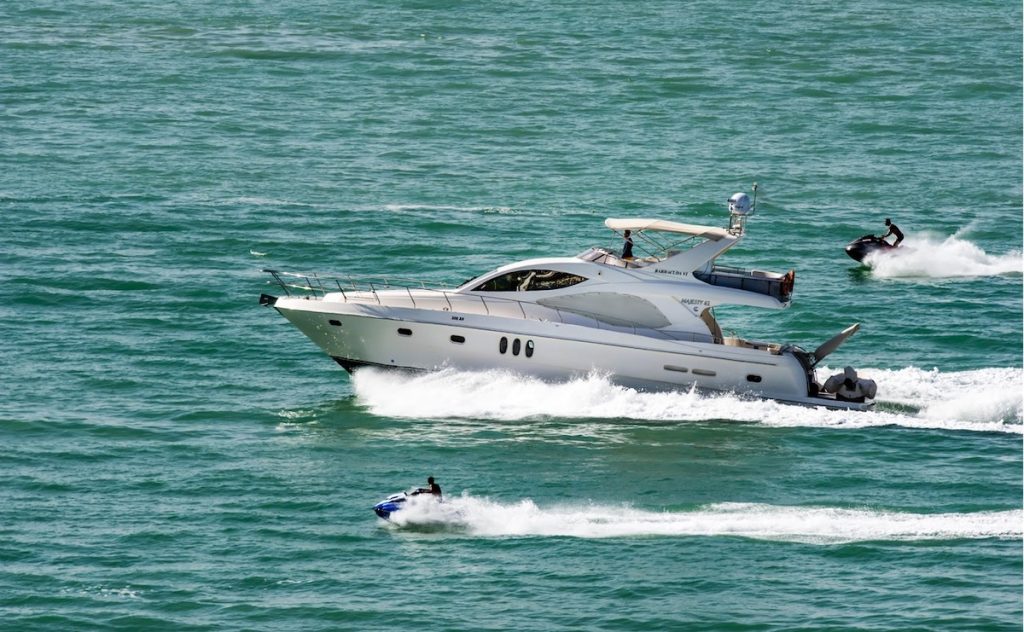 A yacht speeding across the water