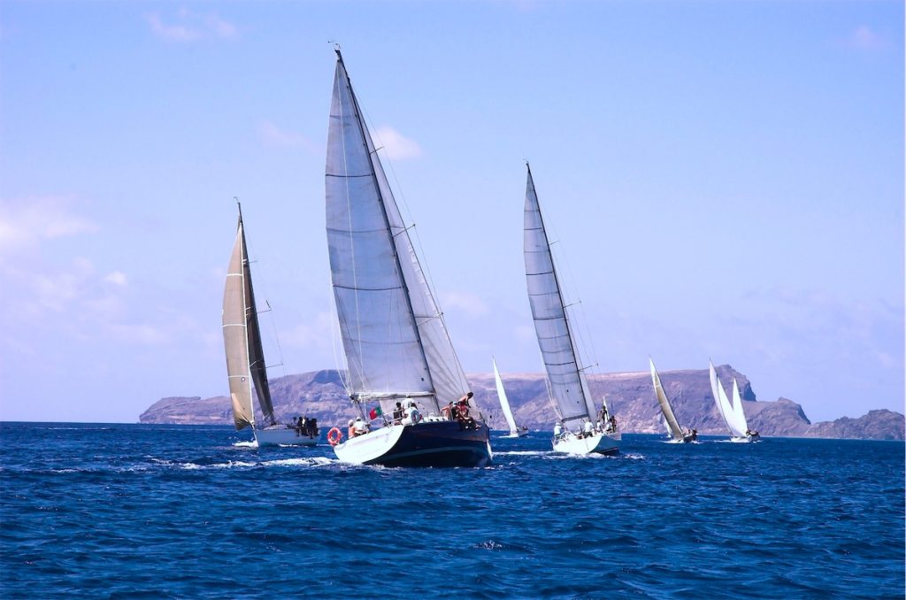 3 sailing yachts sailing across the sea