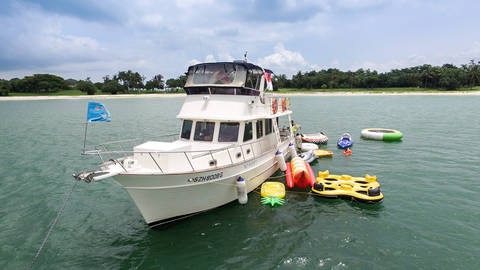 Clipper Heritage with floats, kayaks, and water trampoline