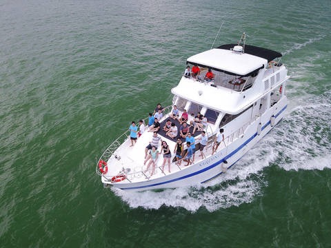 A group of people sitting on the outer deck of Sardinia