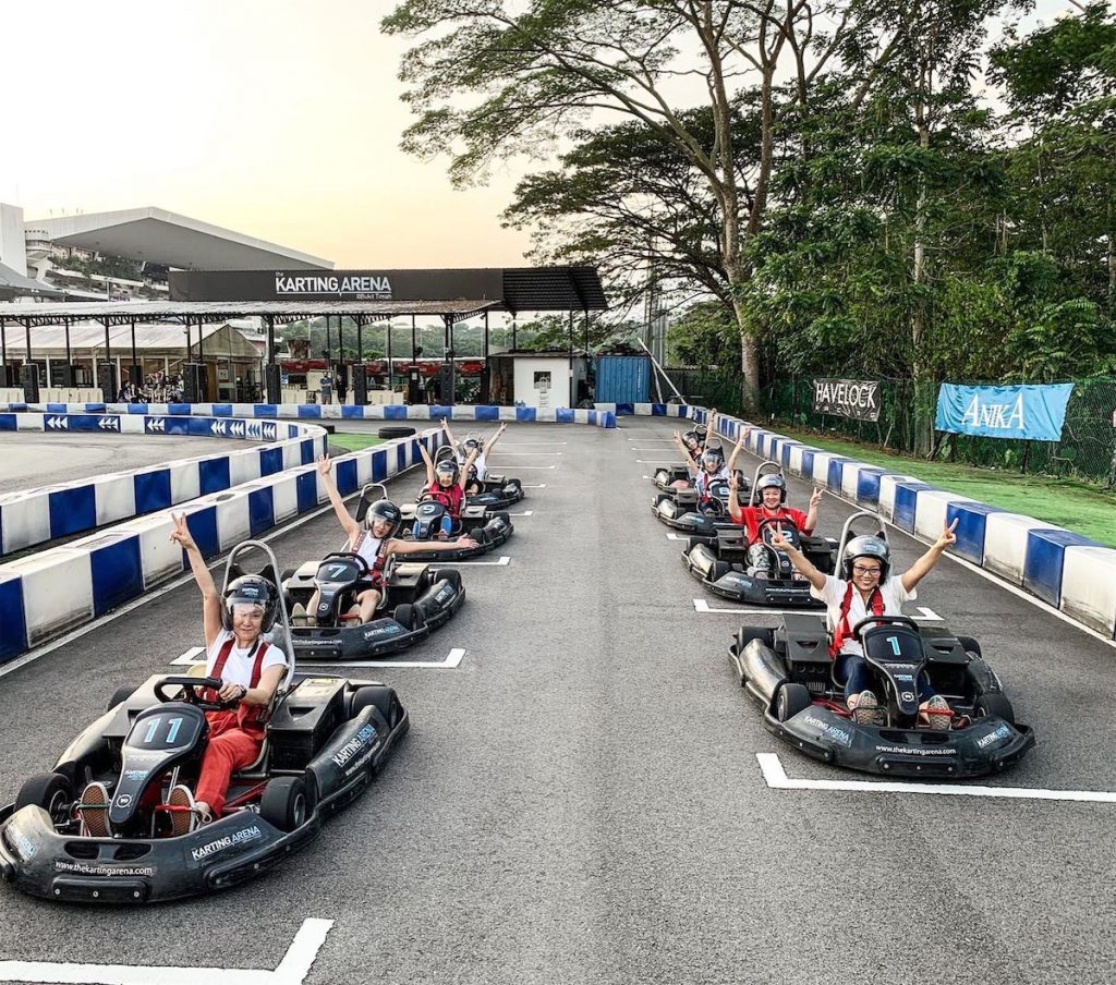 8 people getting ready to start racing