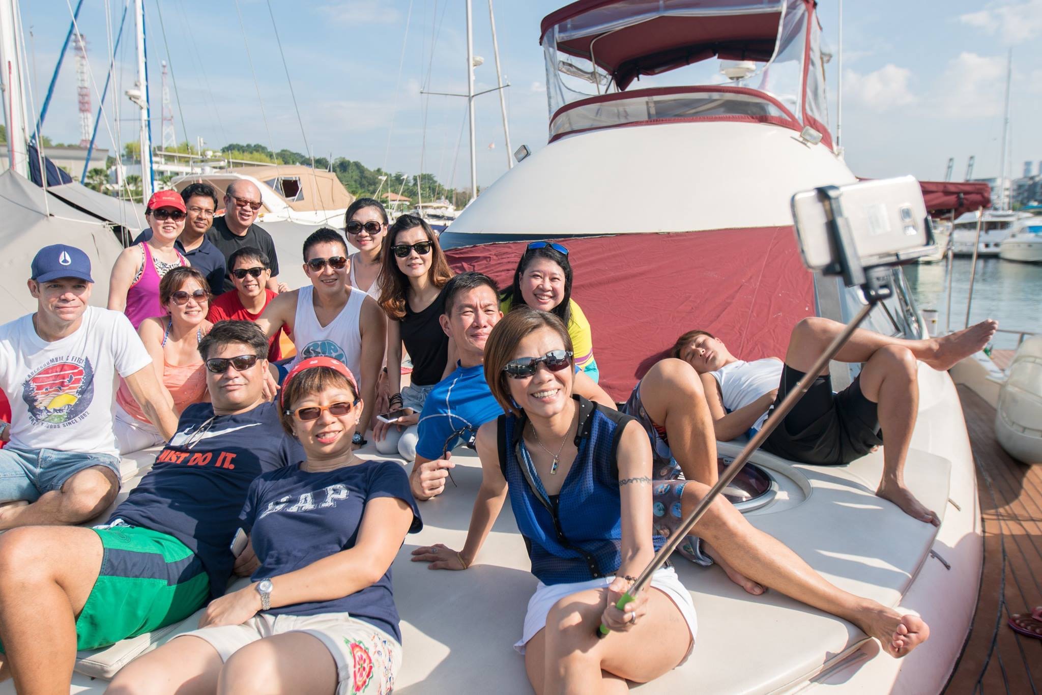 A group of people lounging on the deck of a yacht